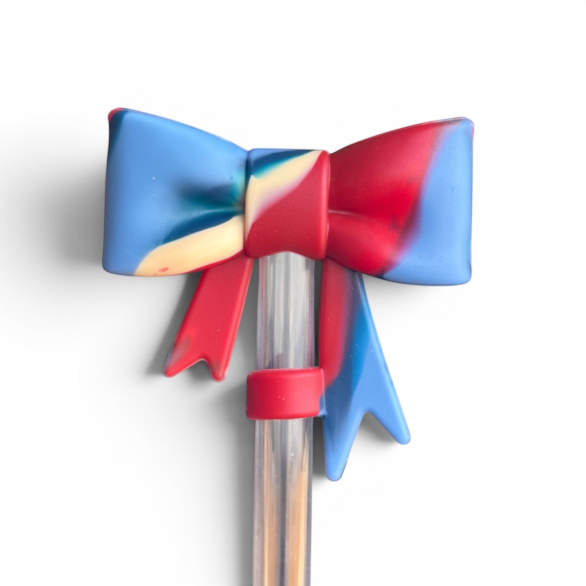 Next Nirvana 3D silicone bow straw topper in red, white, and blue swirl matte finish for tumblers.