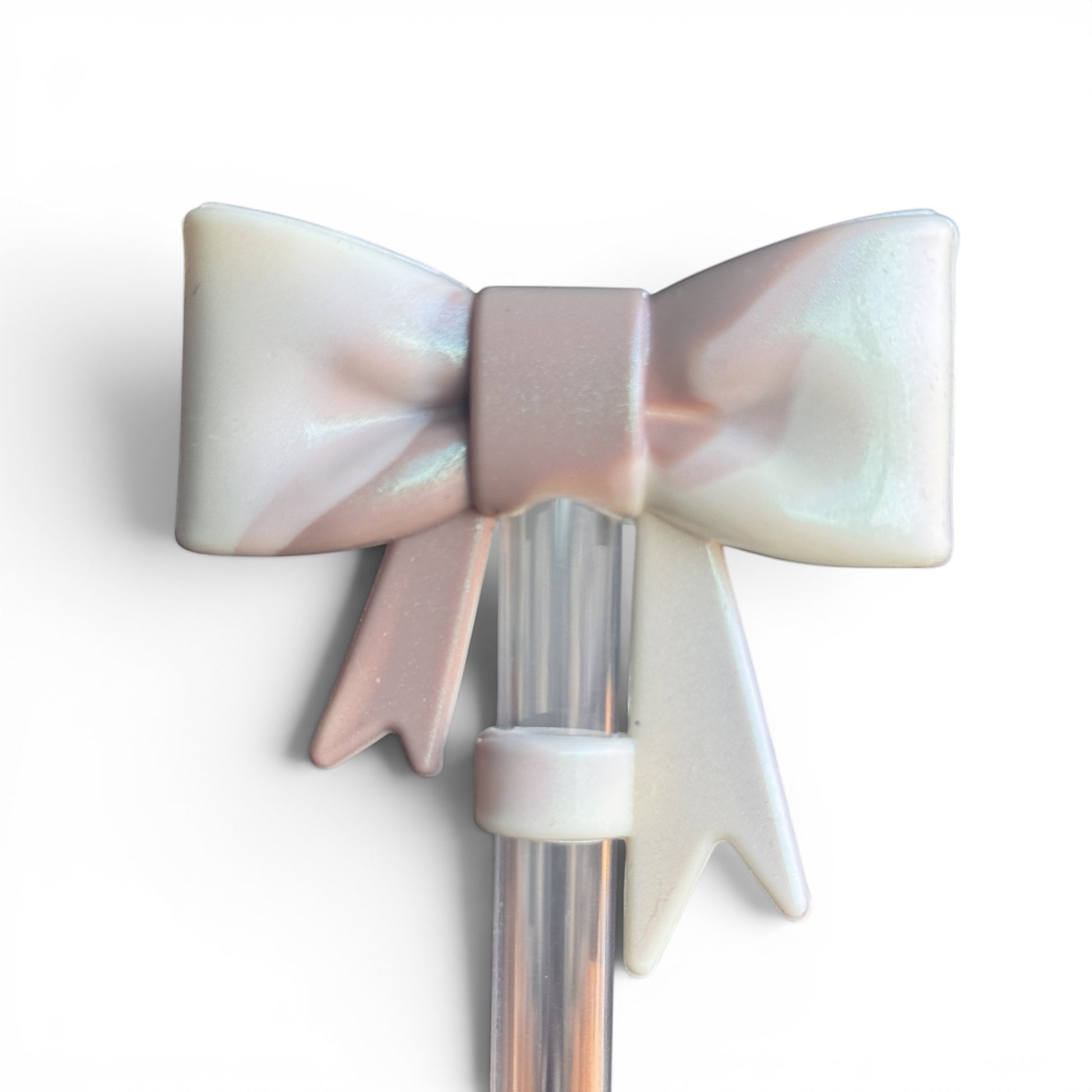 Next Nirvana Almond Rose Bay shimmer 3D bow straw topper for tumblers in a pearlescent pink and white finish.