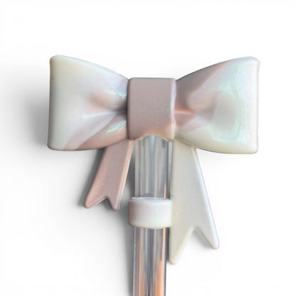Next Nirvana Almond Rose Bay shimmer 3D bow straw topper for tumblers in a pearlescent pink and white finish.