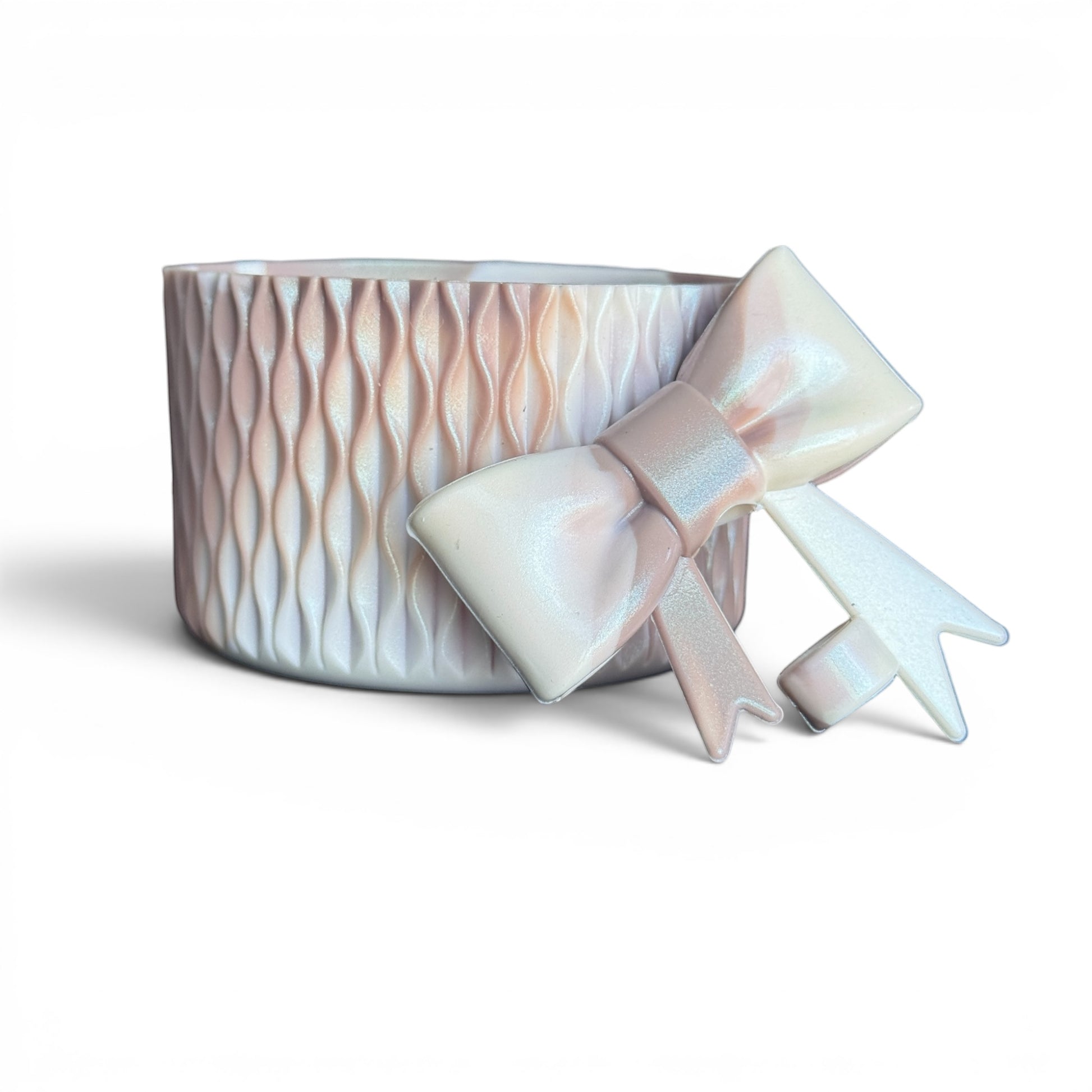 Next Nirvana almond rose shimmer silicone tumbler boot and 3D bow straw topper set with textured wave design.