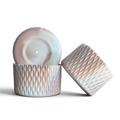 Next Nirvana almond rose shimmer silicone tumbler boot and 3D bow straw topper set with textured wave pattern.