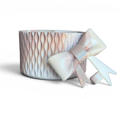 Next Nirvana Almond Rose Bay shimmer silicone tumbler boot and 3D bow straw topper set with a textured wave design.
