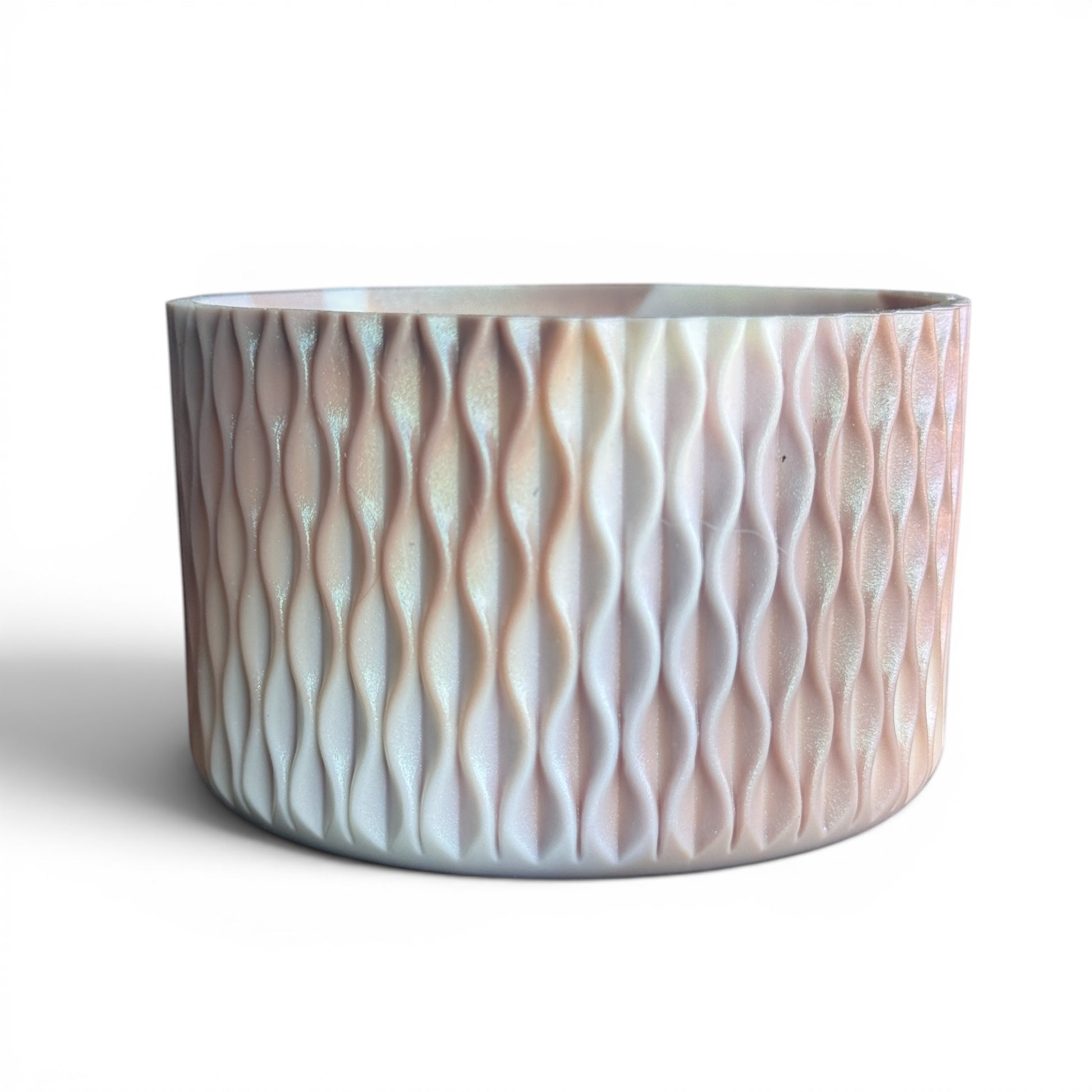 Next Nirvana almond rose shimmer silicone tumbler boot with 3D wave texture for 20-40oz insulated cups.
