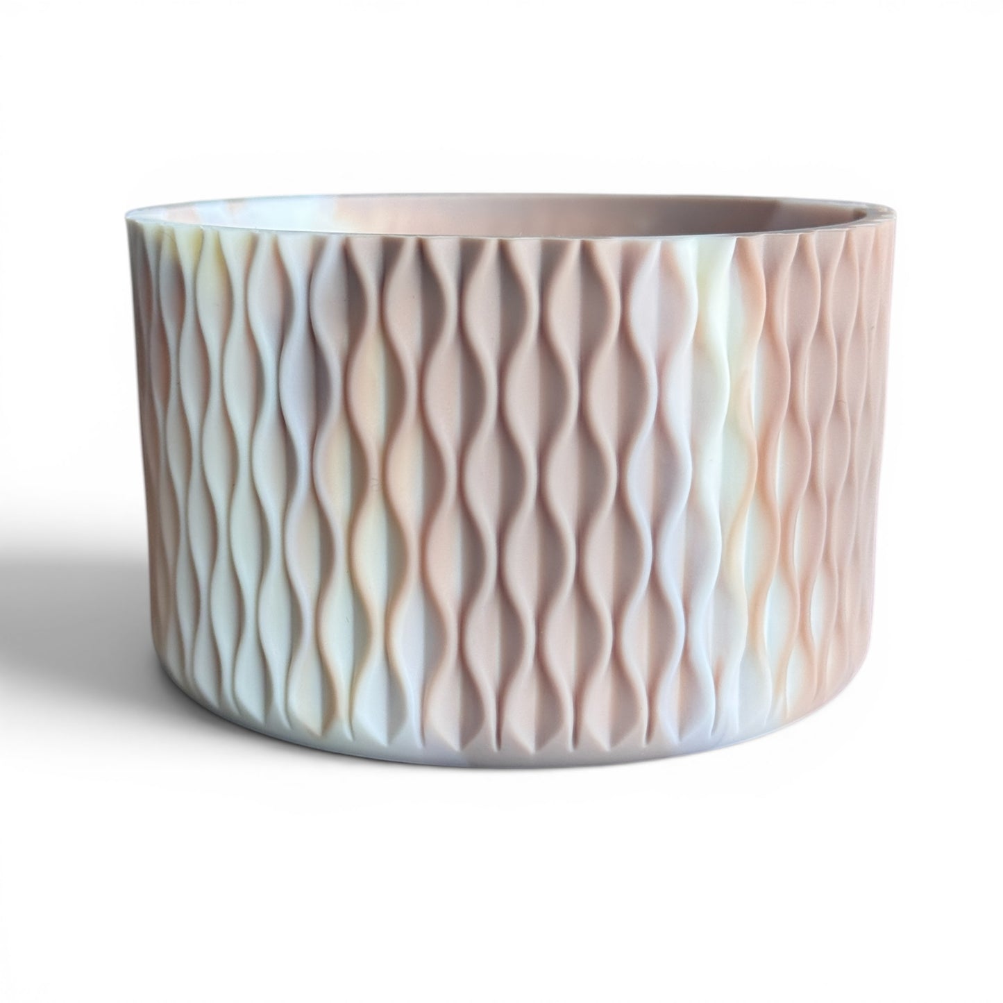Next Nirvana matte almond rose silicone tumbler boot with a 3D wave texture for 20-40oz insulated cups.