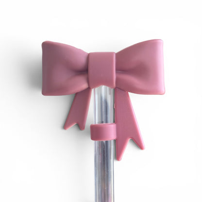 Next Nirvana antique pink matte silicone 3D bow straw topper for tumblers on a clear straw