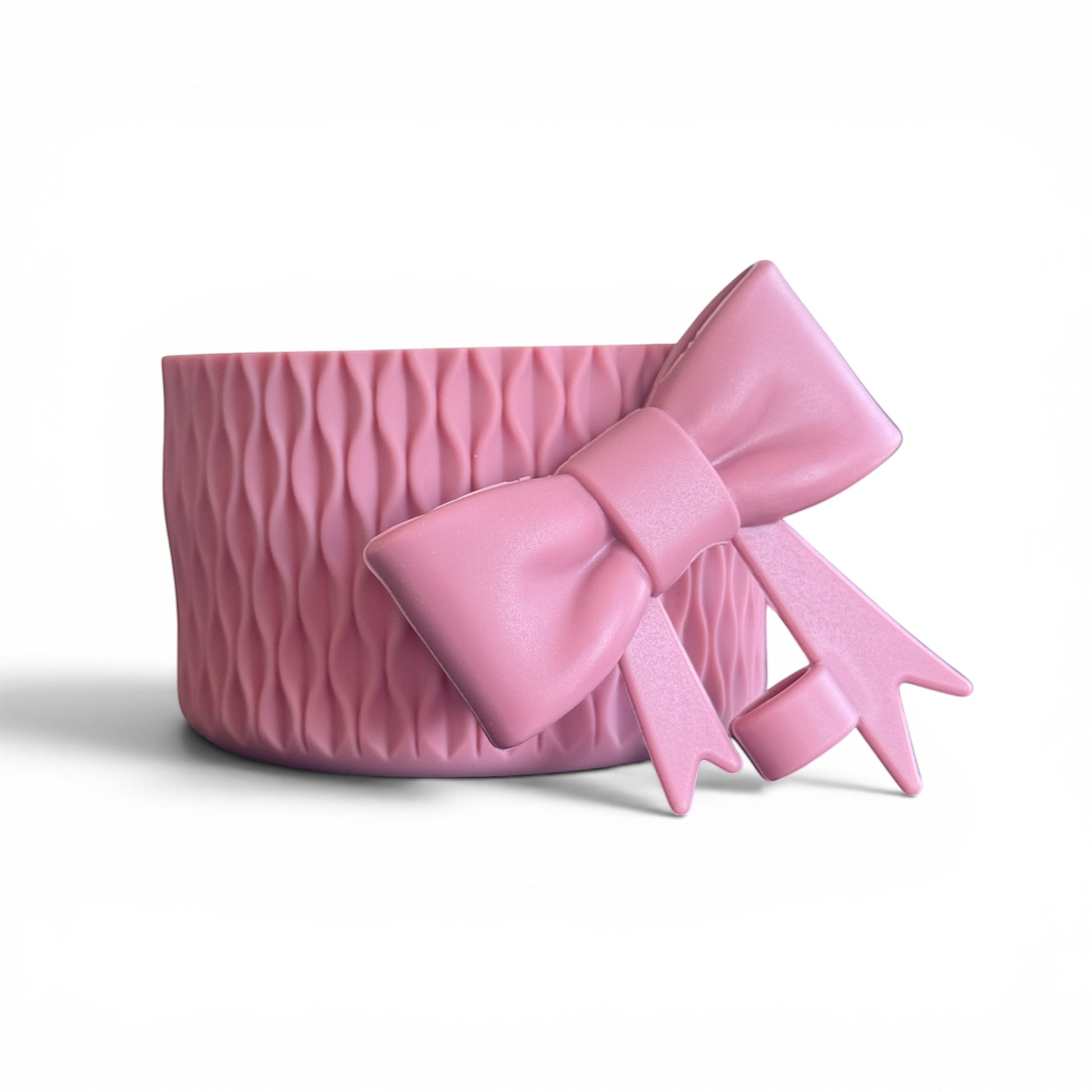 Next Nirvana antique pink silicone tumbler boot with a matching 3D bow straw topper and textured wave design.