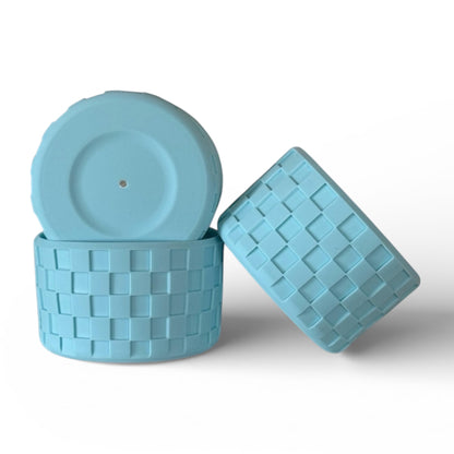 Next Nirvana aqua blue silicone tumbler boot with a textured checkerboard pattern for protective cup coverage.