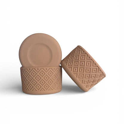 Next Nirvana beige silicone tumbler boot with a textured diamond pattern for protective non-slip grip on water bottles.