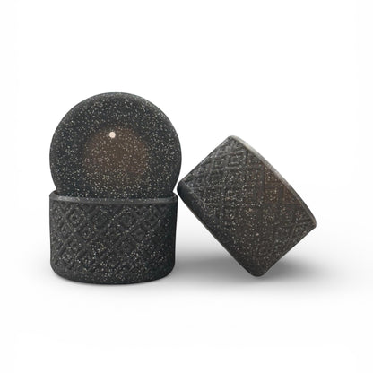 Next Nirvana black silicone tumbler boot with a textured diamond pattern and glitter finish for protective grip.
