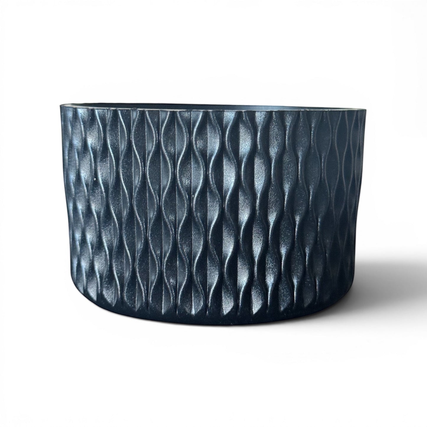 Next Nirvana black silicone tumbler boot with a textured 3D waves pattern for 20oz to 40oz insulated cups.