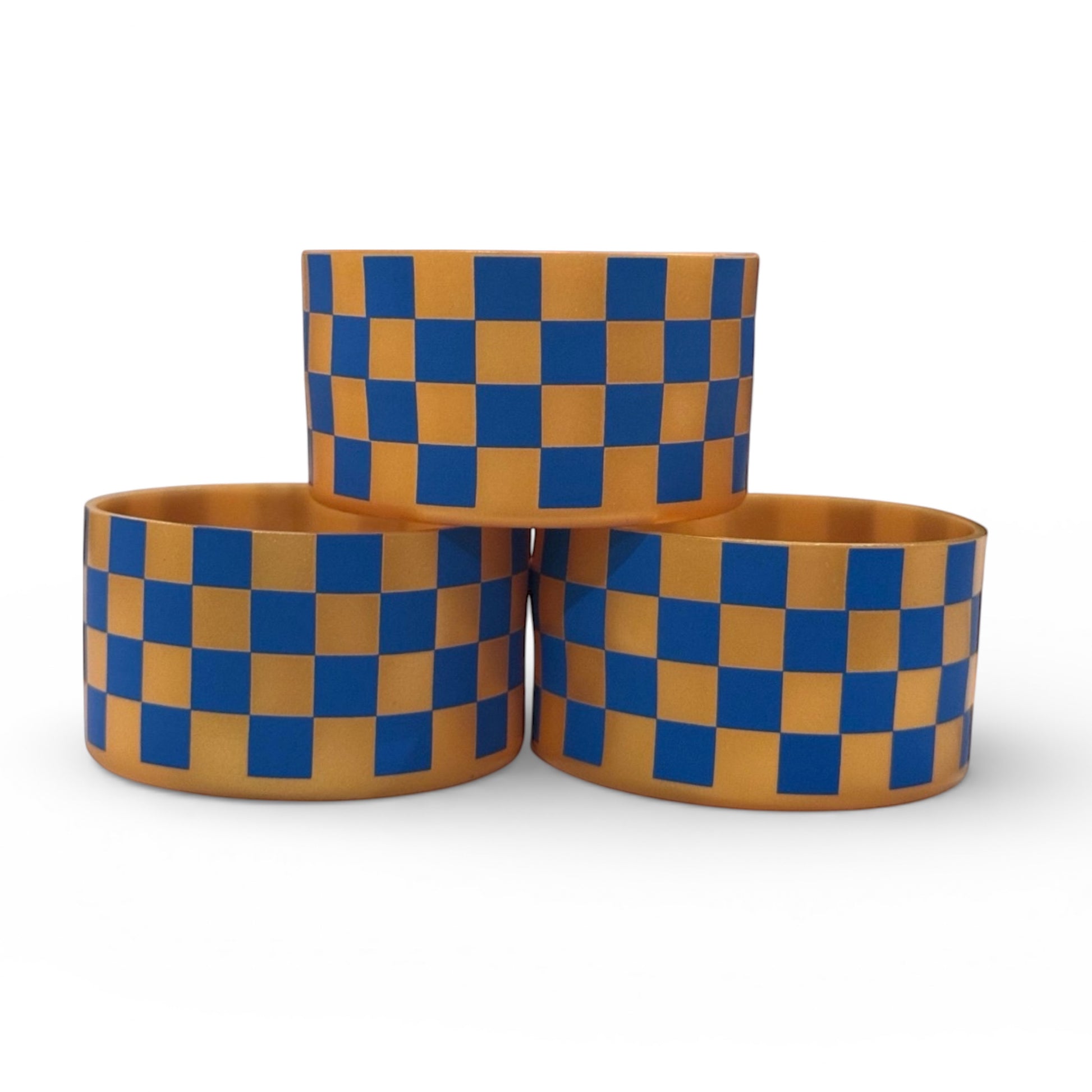 Next Nirvana silicone tumbler boot featuring a blue and gold checkered pattern for Stanley and other tumblers.
