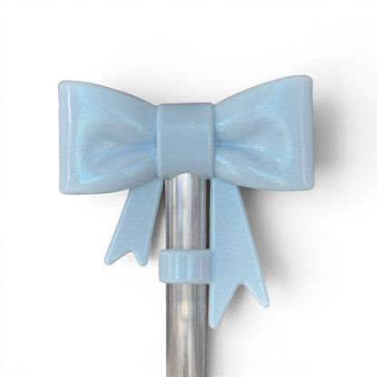 Next Nirvana light blue shimmer 3D bow silicone straw topper for tumblers, featuring a cute and durable design.