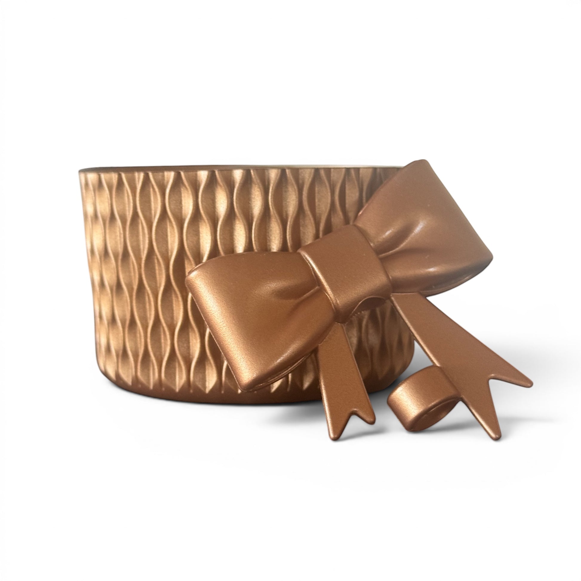 Next Nirvana bronze silicone tumbler boot with matching 3D bow straw topper featuring a textured wave design.