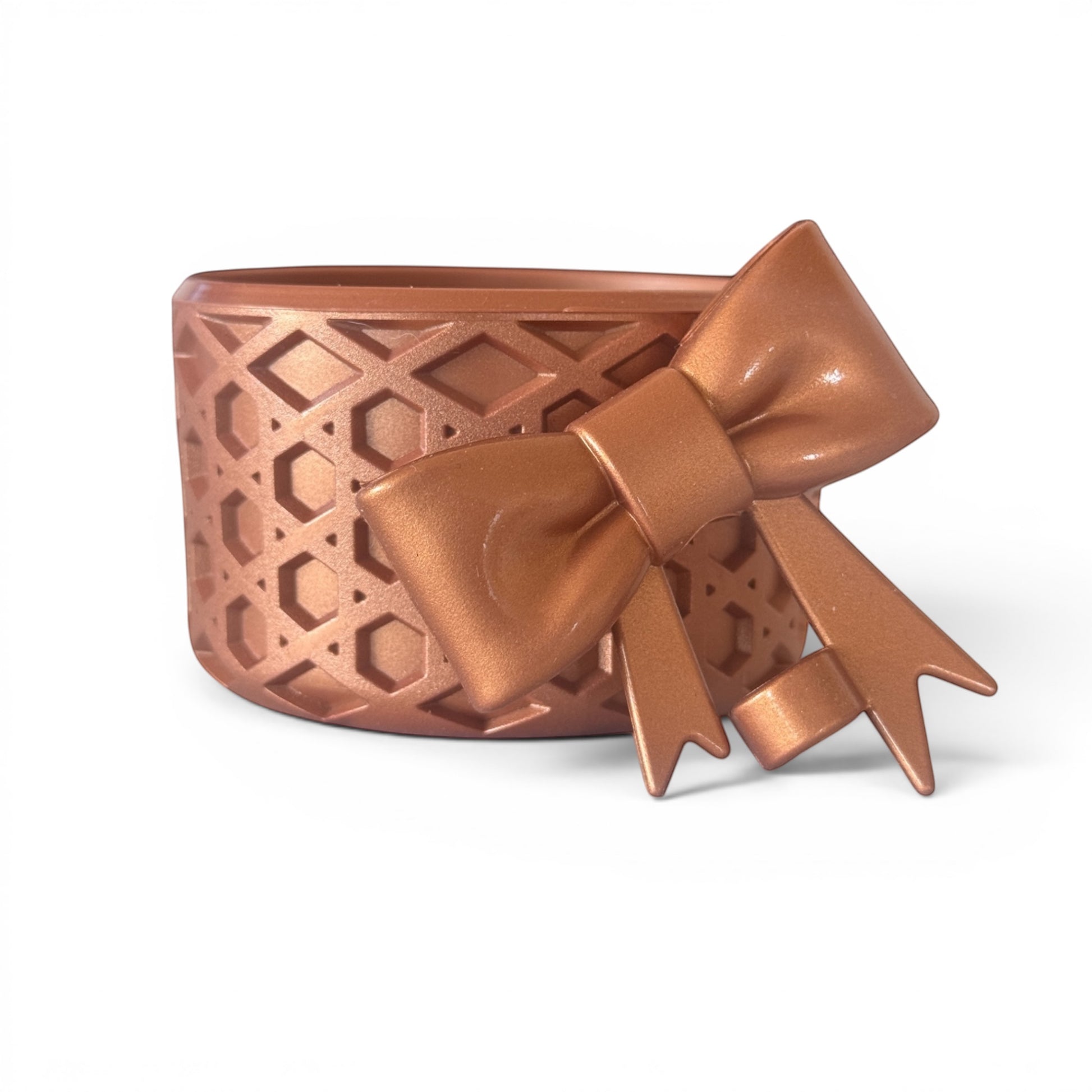 Next Nirvana bronze waffle-textured silicone tumbler boot and matching 3D bow straw topper set for insulated cups.
