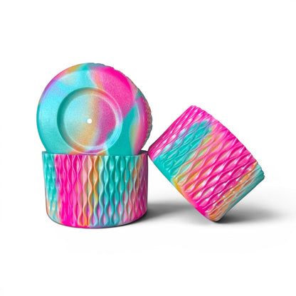 Next Nirvana Cabana Crush silicone tumbler boot set with a vibrant pink, teal, and orange wavy 3D textured design.
