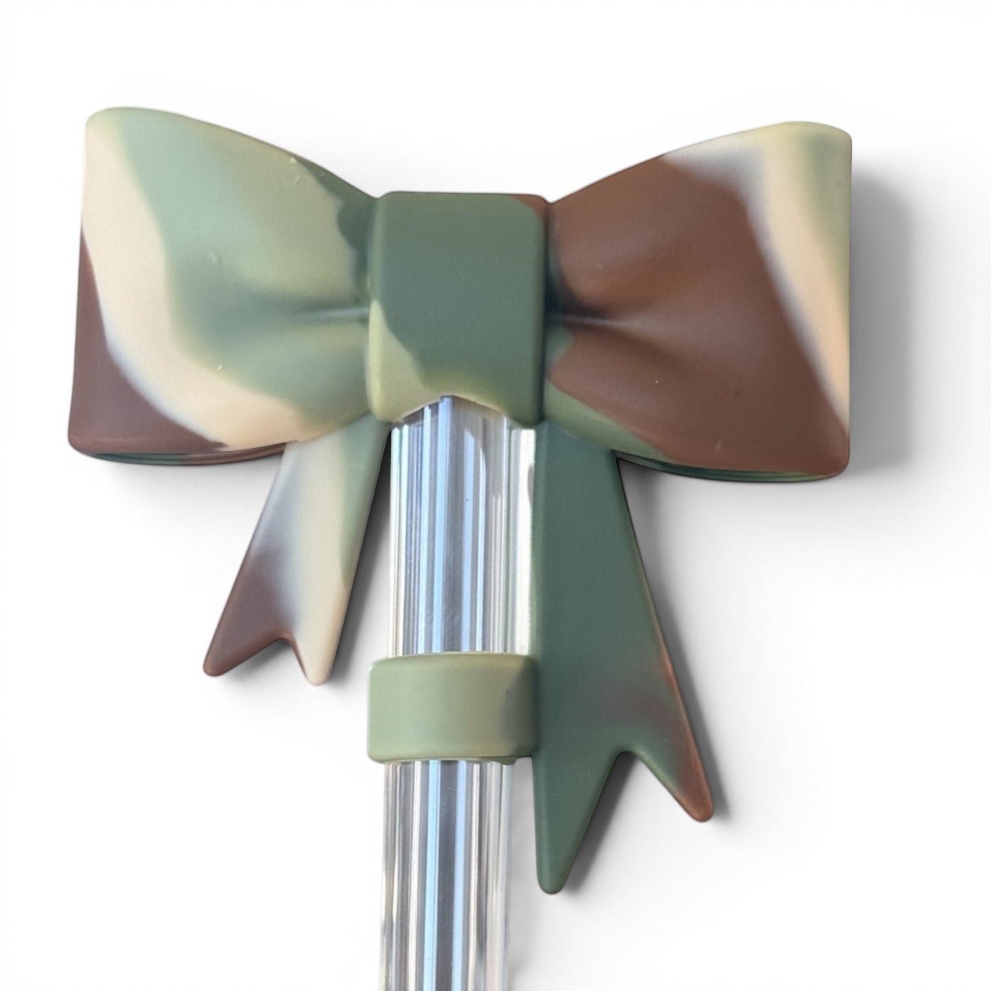 Next Nirvana camo silicone 3D bow straw topper for tumblers in matte green, brown, and cream camouflage pattern