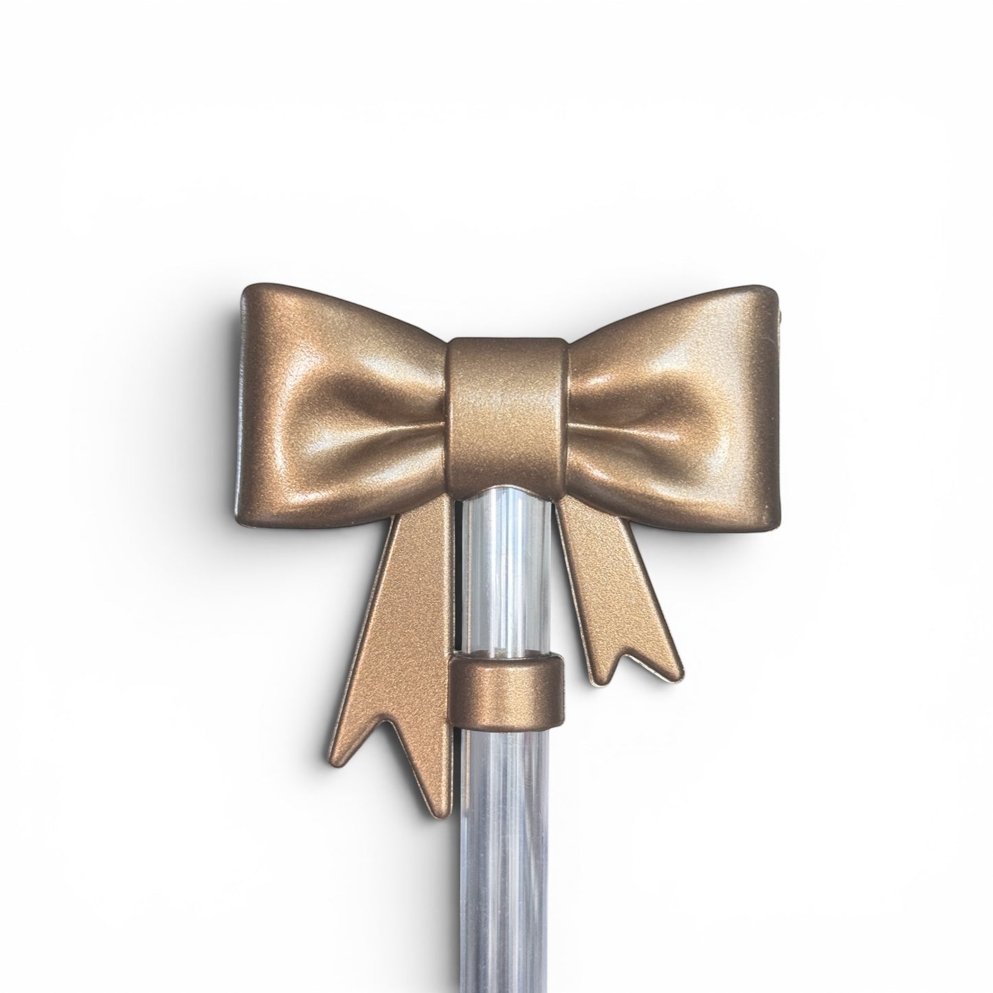Next Nirvana champagne-colored 3D silicone bow straw topper for tumblers, featuring a textured, elegant design.