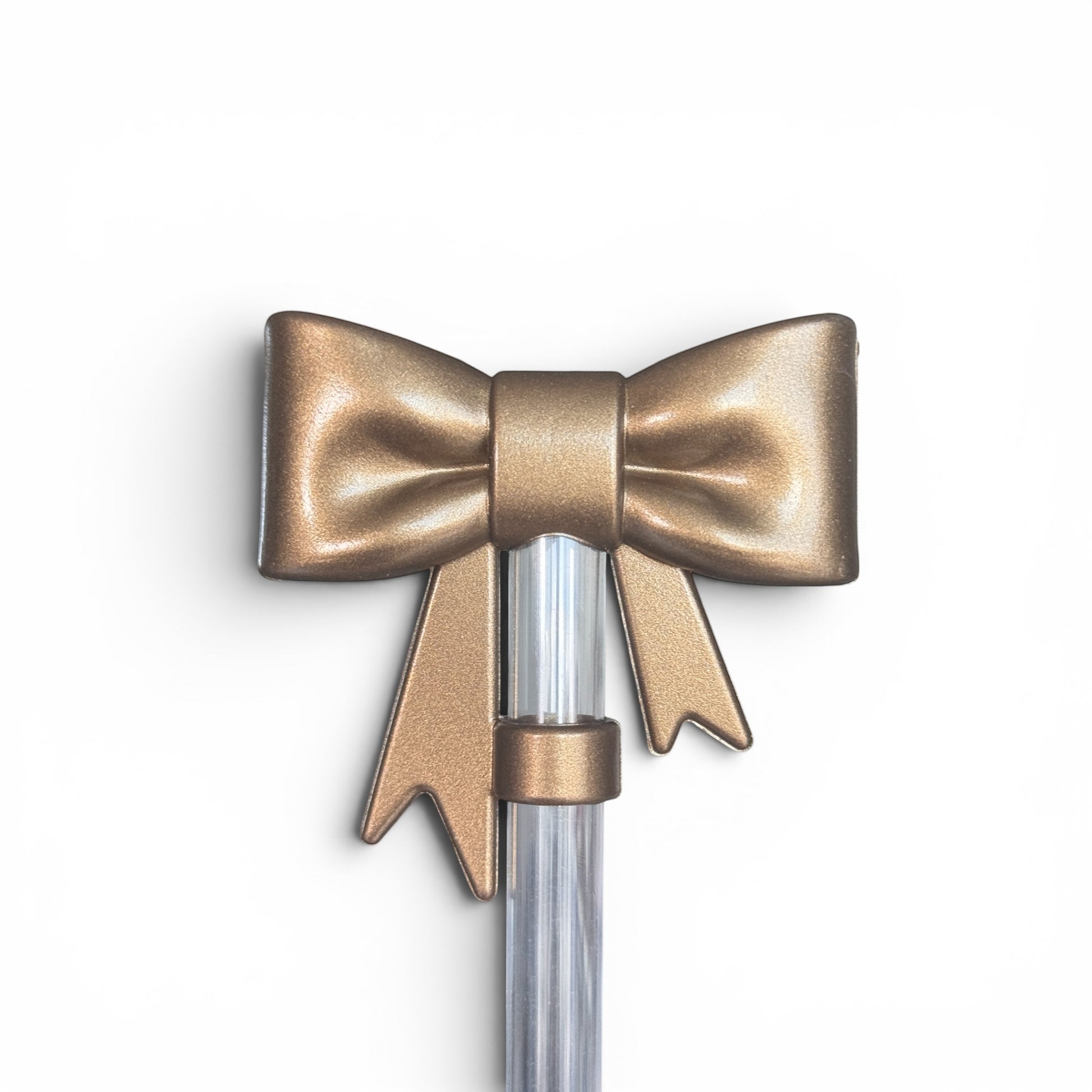 Next Nirvana champagne-colored 3D silicone bow straw topper for tumblers, featuring a textured, elegant design.