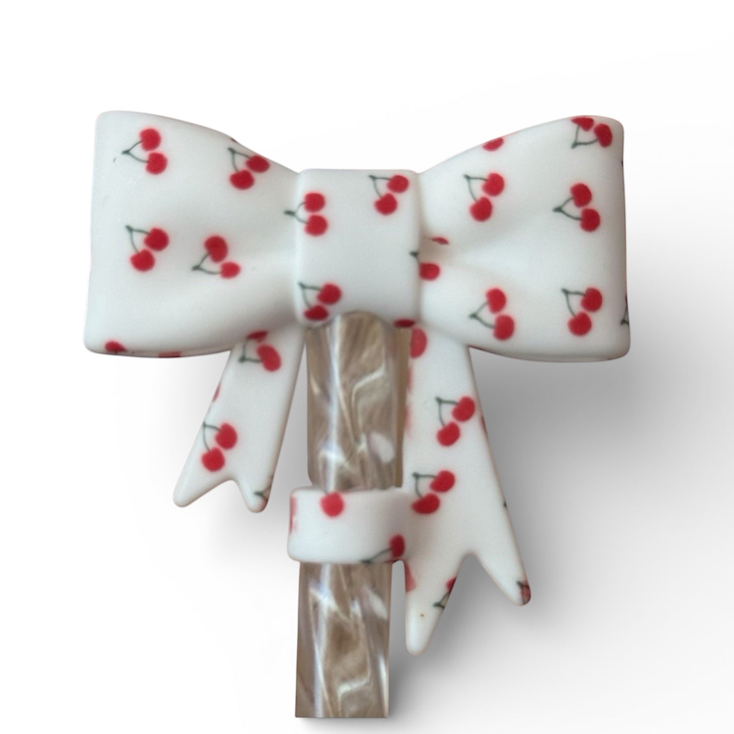 Next Nirvana white silicone straw topper featuring a 3D bow design with a small red cherry print for 10mm straws.