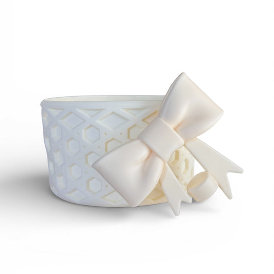 Next Nirvana cream silicone tumbler boot with a 3D bow and waffle texture for protective cup accessory