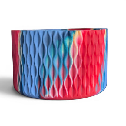 Next Nirvana Firecracker Bay silicone tumbler boot with a matte red and blue wavy 3D texture for 20-40oz drinkware.