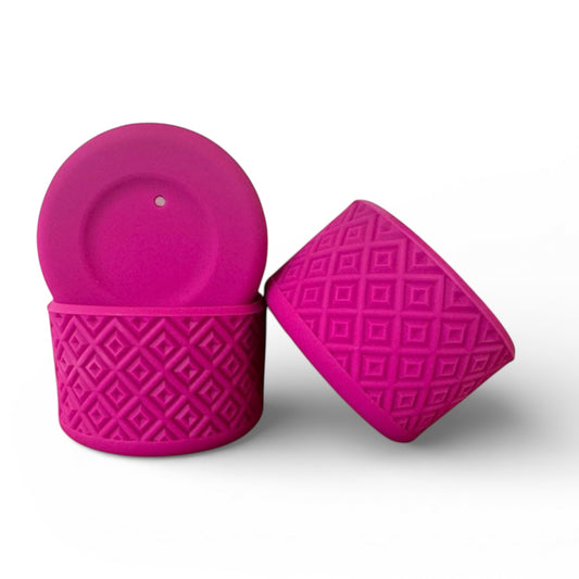 Next Nirvana fuchsia silicone tumbler boot with a textured diamond pattern for protective non-slip grip