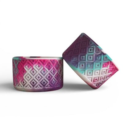 Next Nirvana Heat Wave silicone tumbler boot with a pink, purple, and teal diamond textured pattern.