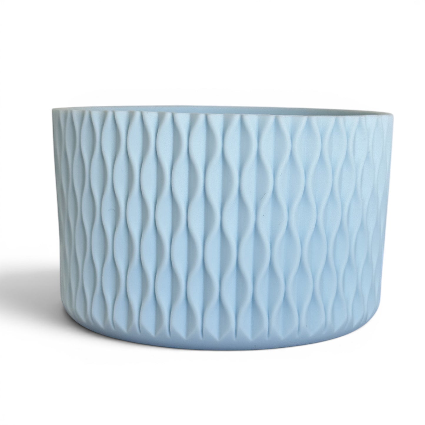 Next Nirvana matte light blue silicone tumbler boot with a 3D textured wave pattern for 20-40oz insulated cups.