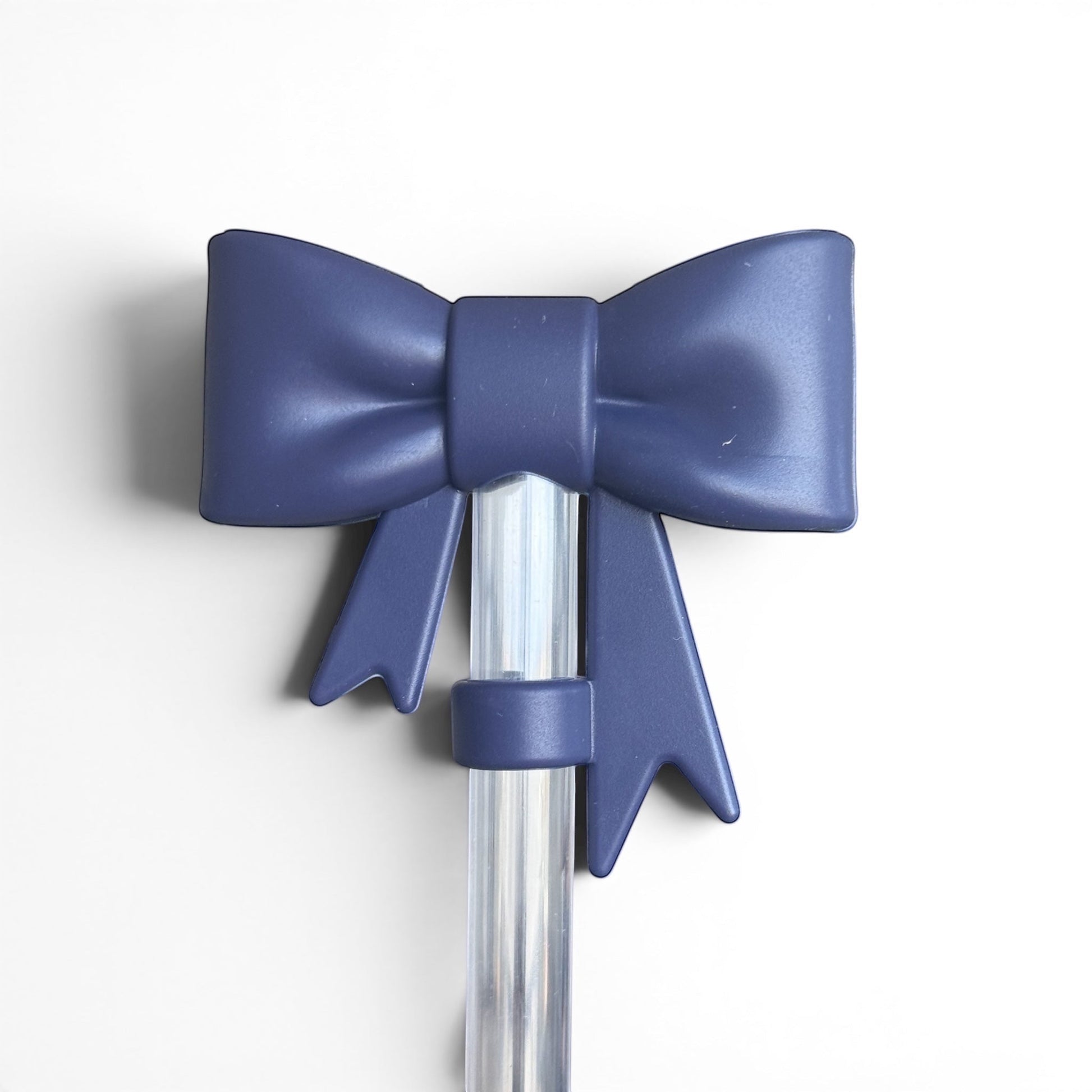 Next Nirvana navy matte silicone 3D bow straw topper for tumblers, featuring a smooth, flexible design.