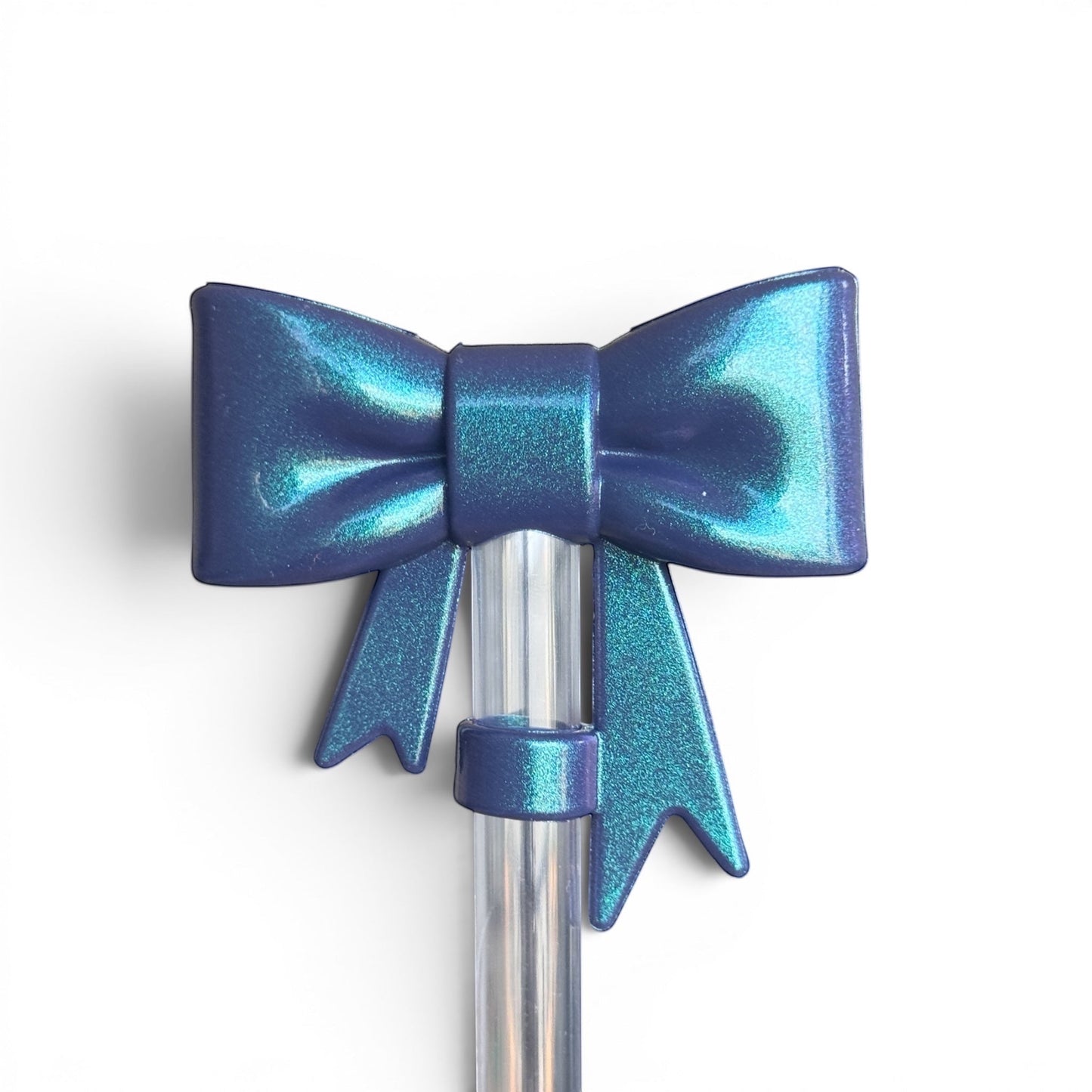 Next Nirvana navy shimmer 3D bow straw topper for tumblers, made of flexible BPA-free silicone with a metallic finish.