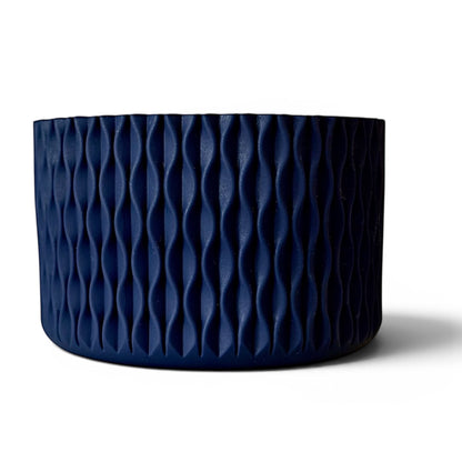 Next Nirvana navy blue silicone tumbler boot with a 3D textured wave pattern for 20oz to 40oz insulated cups.
