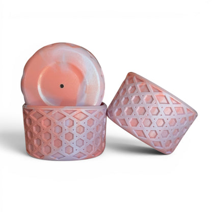 Next Nirvana orchid shimmer waffle silicone tumbler boot and matching 3D bow straw topper set in pink and purple.