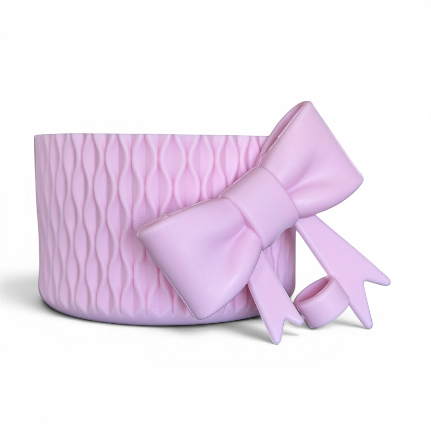 Next Nirvana pink matte silicone tumbler boot with 3D wave texture and matching bow straw topper for 20-40oz cups.