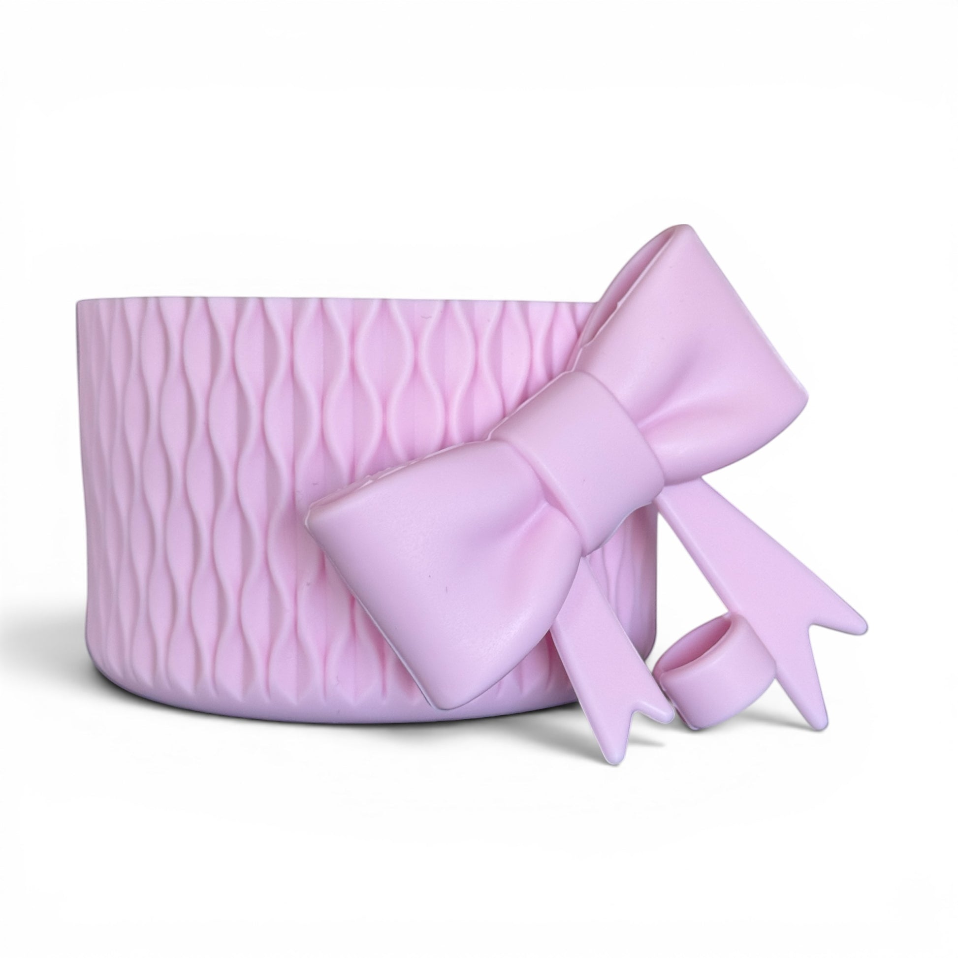 Next Nirvana pink matte silicone tumbler boot with 3D wave texture and matching bow straw topper for 20-40oz cups.