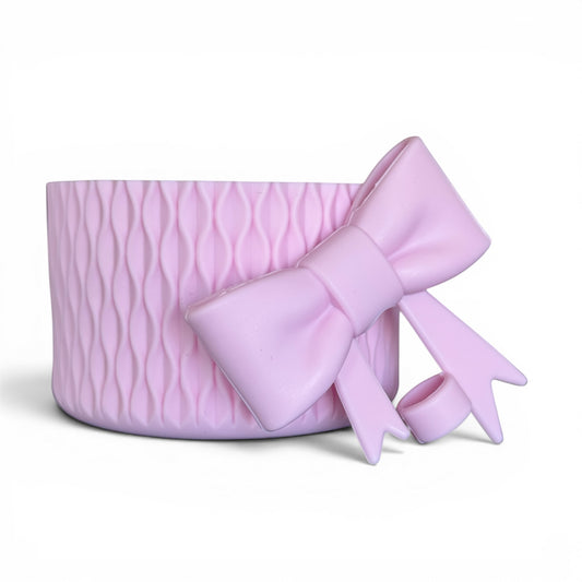 Next Nirvana pink matte silicone tumbler boot with 3D wave texture and matching bow straw topper for 20-40oz cups.