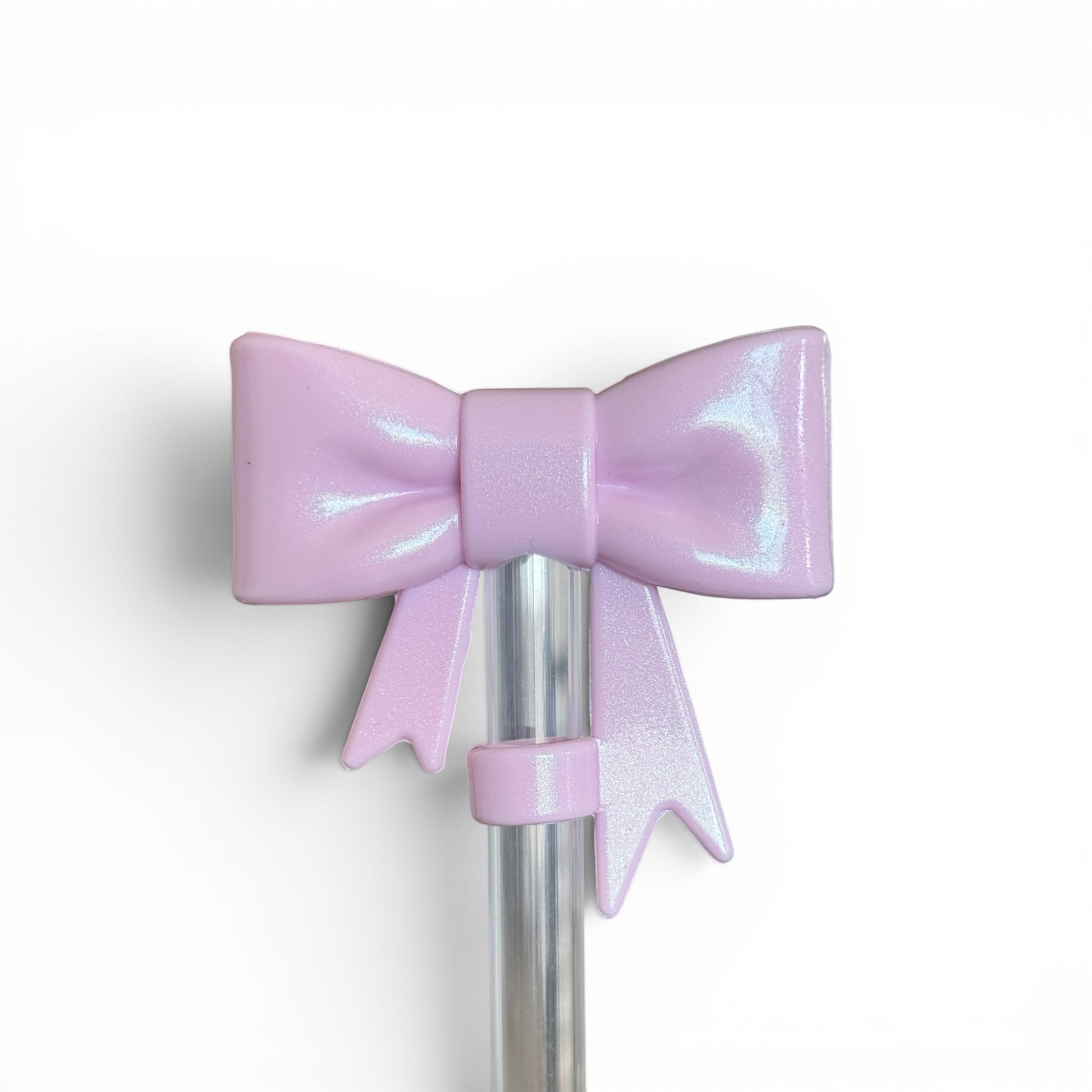 Next Nirvana pink sand shimmer 3D bow silicone straw topper for tumblers with a pearlescent finish