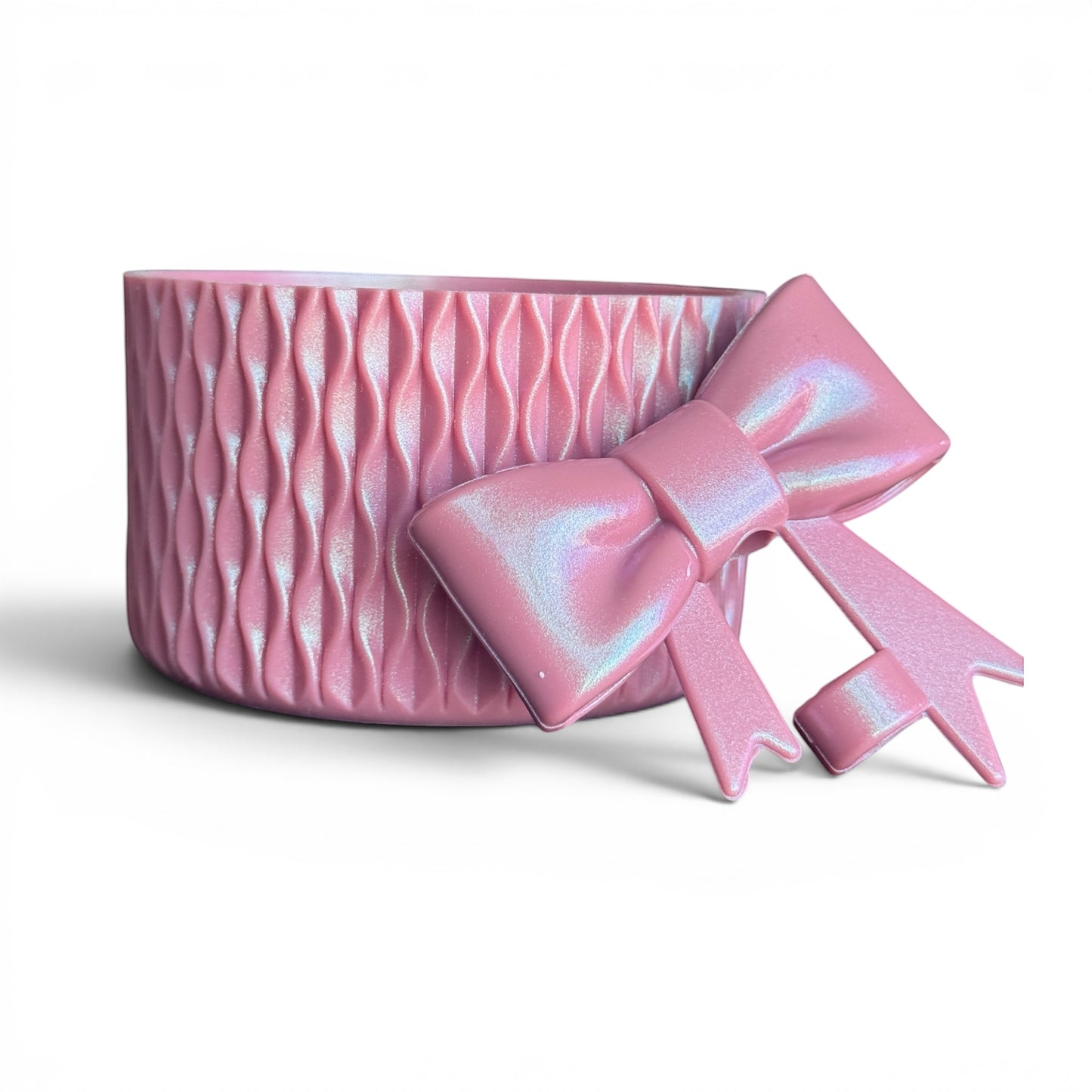 Next Nirvana antique pink shimmer silicone tumbler boot and matching 3D bow straw topper with wavy textured design.