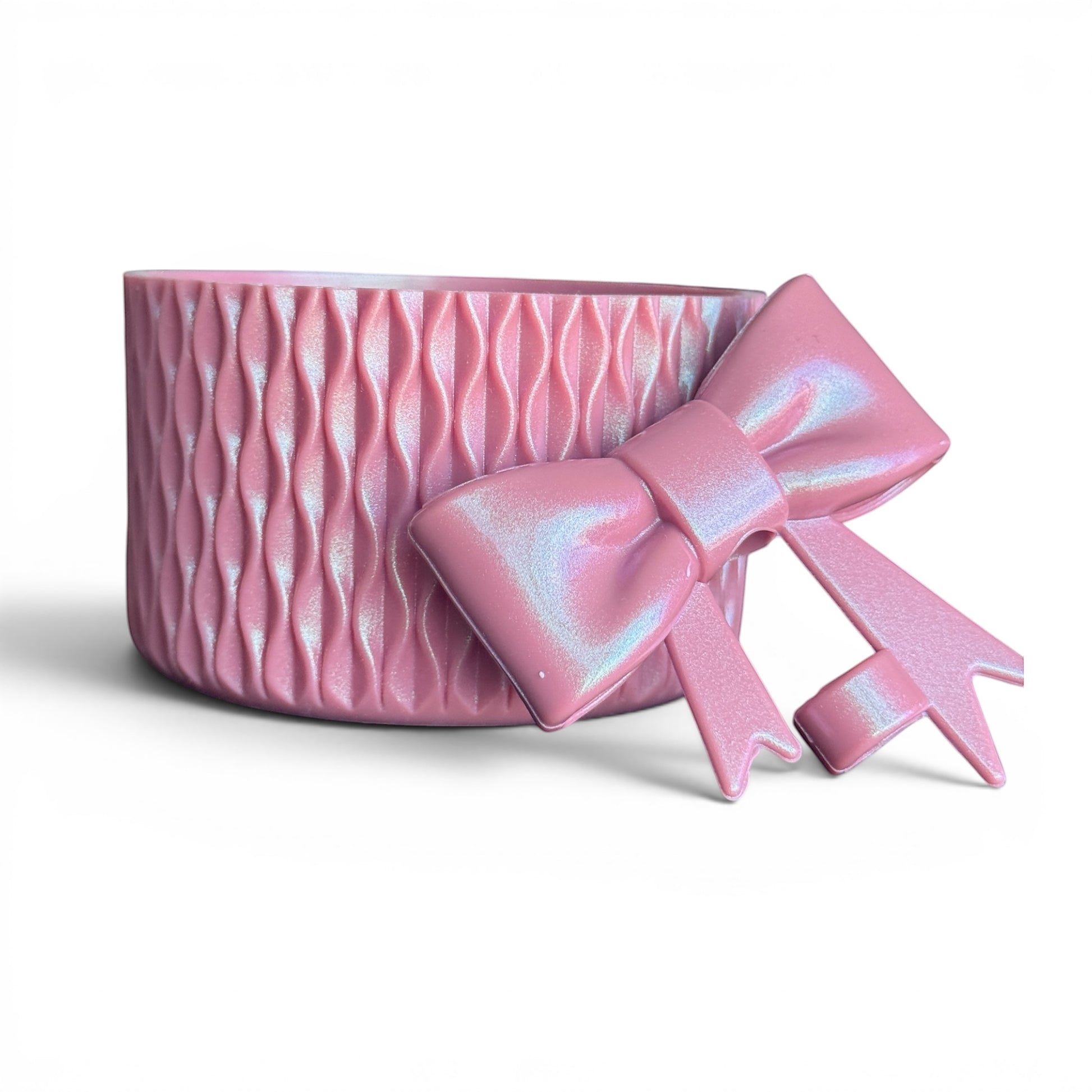 Next Nirvana antique pink shimmer silicone tumbler boot and matching 3D bow straw topper with wavy textured design.