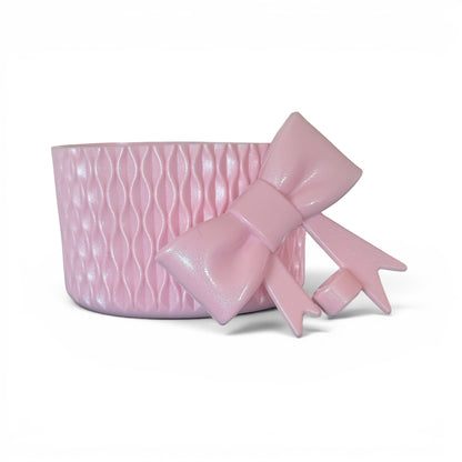 Next Nirvana rose pink shimmer silicone tumbler boot with wave texture and matching 3D bow straw topper accessory.