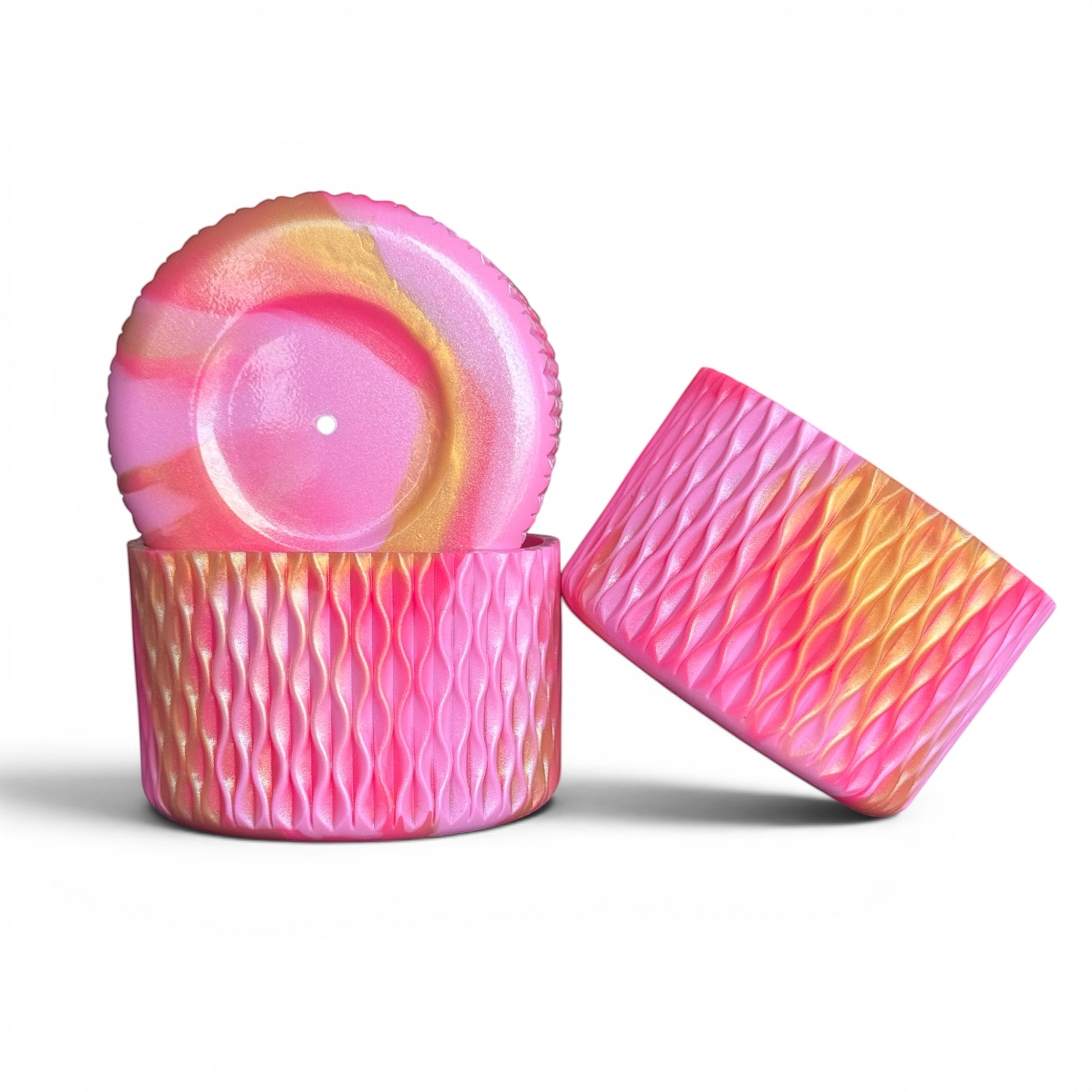 Next Nirvana pink and gold shimmer silicone tumbler boot and 3D bow straw topper set with a textured wave design.