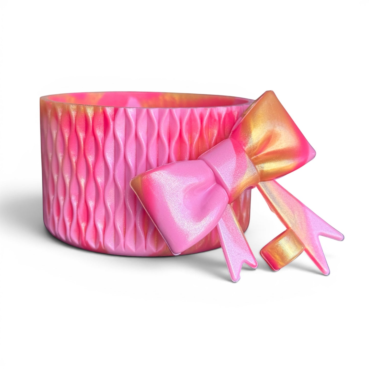 Next Nirvana pink and gold shimmer silicone tumbler boot with a matching 3D bow straw topper for 20-40oz cups.