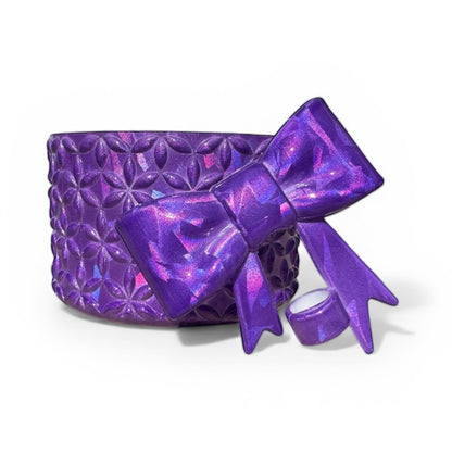 Next Nirvana purple holographic silicone tumbler boot with matching 3D bow straw topper and floral texture.