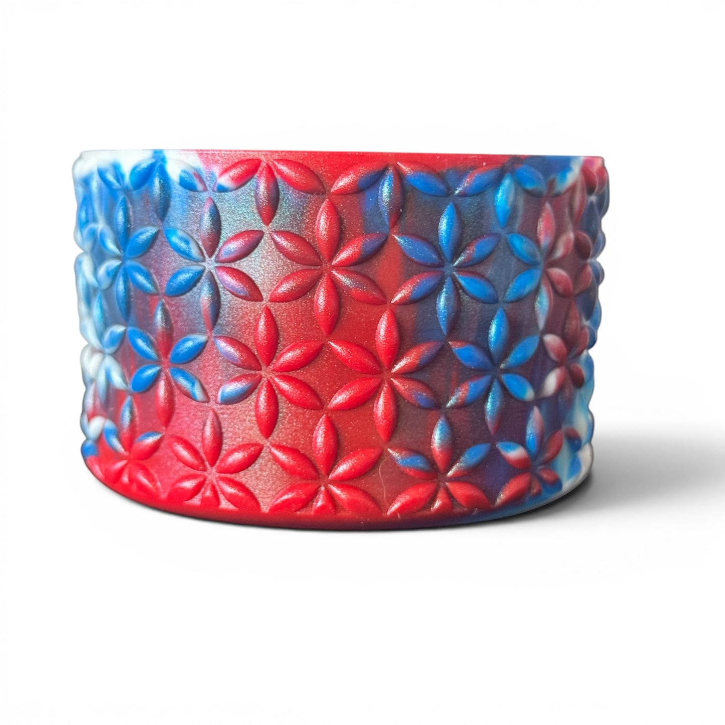 Next Nirvana red and blue floral pattern silicone tumbler boot with a 3D textured design for drinkware protection.