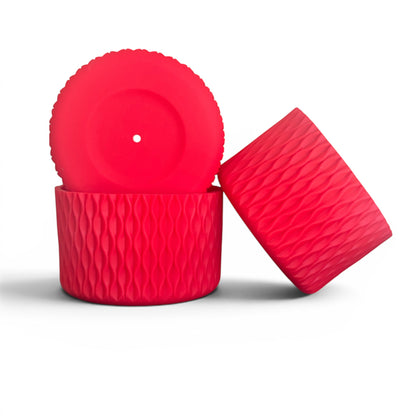 Next Nirvana red silicone tumbler boot with a textured wave pattern for protective non-slip grip on water bottles.