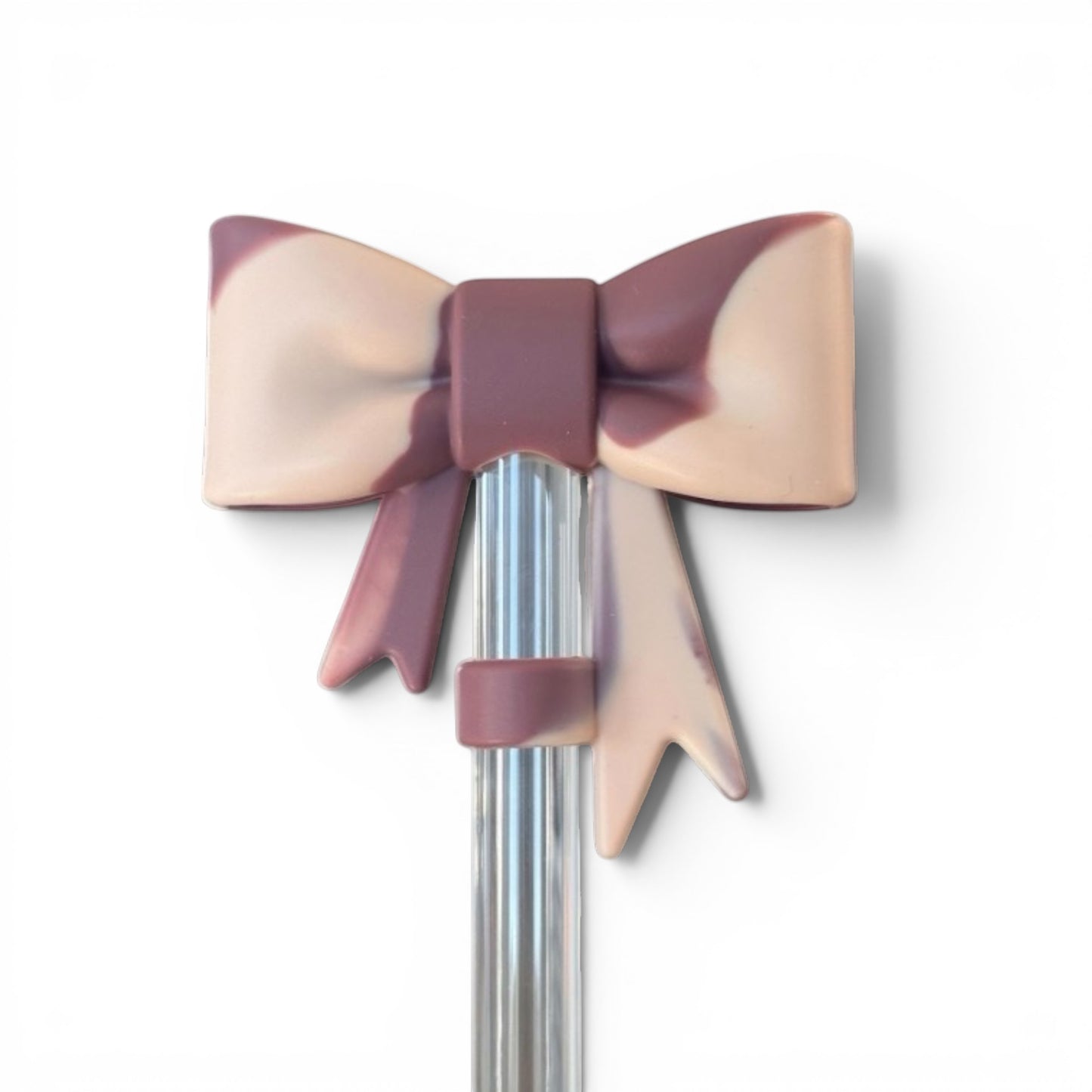 Next Nirvana rose quartz marble silicone 3D bow straw topper for tumblers on a clear straw against a white background