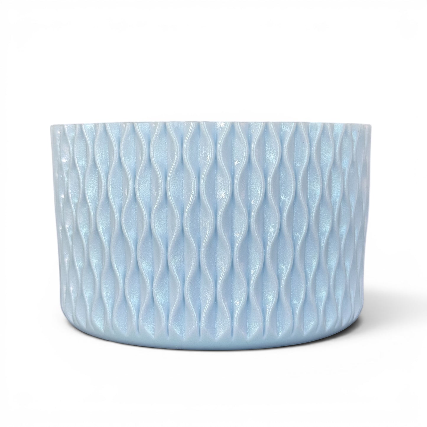 Next Nirvana light blue shimmer silicone tumbler boot with a 3D textured wave pattern for 20-40oz drinkware.