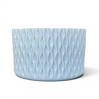 Next Nirvana light blue shimmer silicone tumbler boot with a 3D textured wave pattern for 20-40oz drinkware.