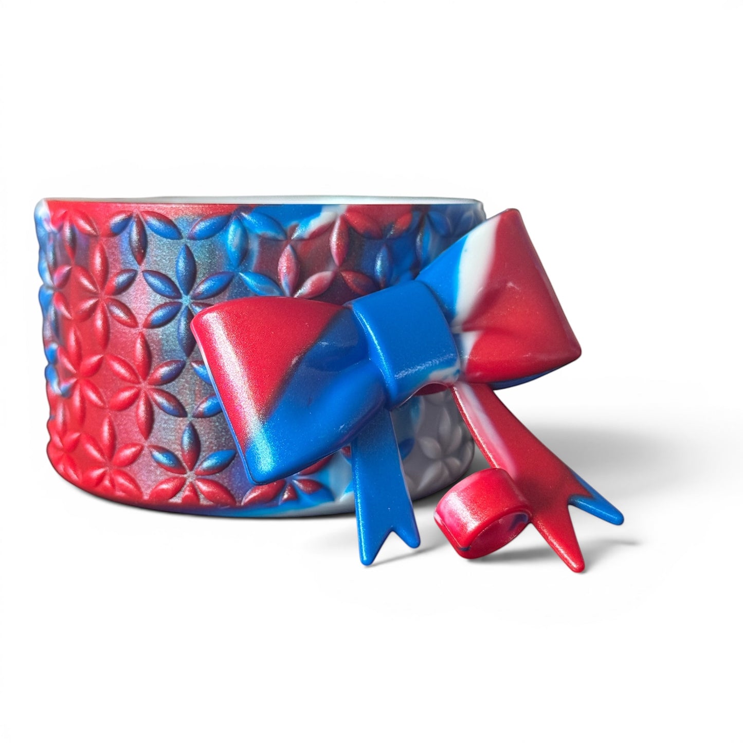 Next Nirvana red white and blue silicone tumbler boot and matching 3D bow straw topper with floral pattern