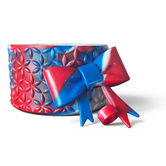 Next Nirvana red white and blue silicone tumbler boot and matching 3D bow straw topper with floral pattern