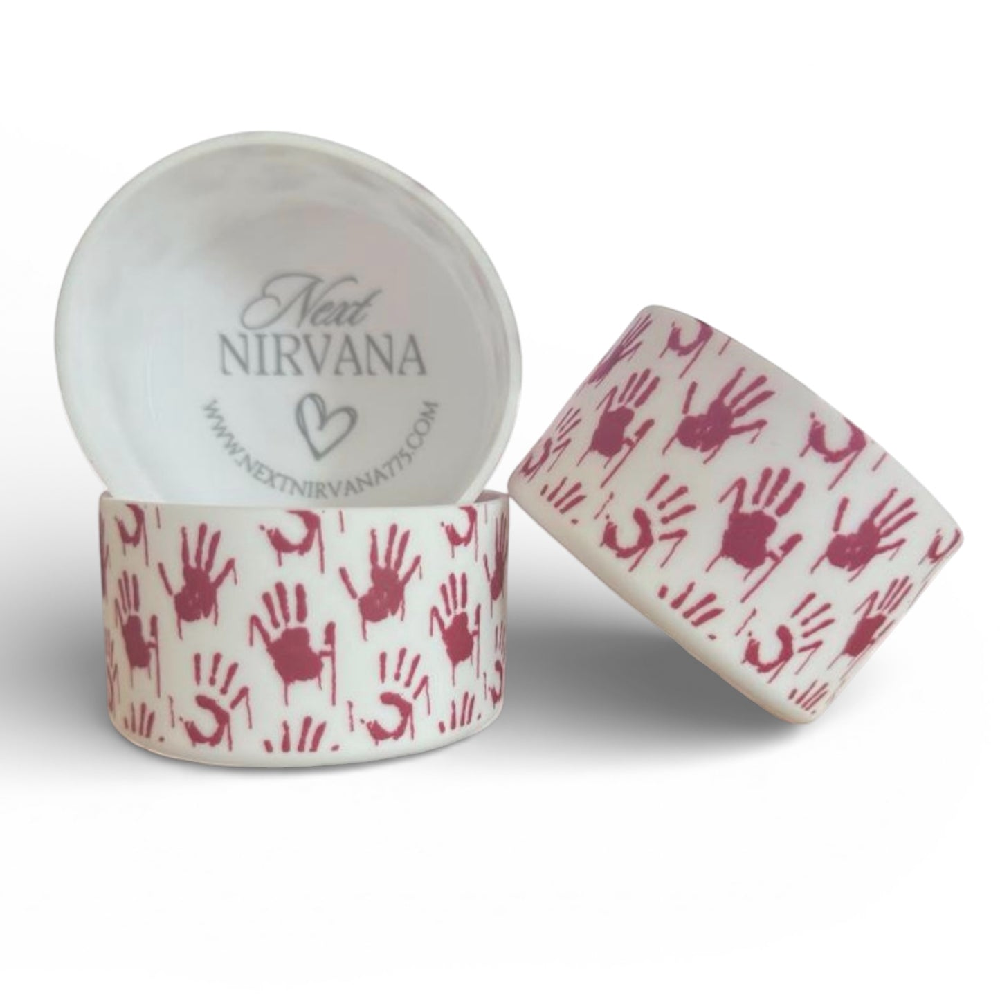 Next Nirvana silicone tumbler boot featuring a white base with a red handprint pattern, designed for tumbler protection.